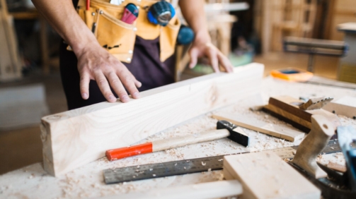 examining-quality-wooden-board_1098-15849